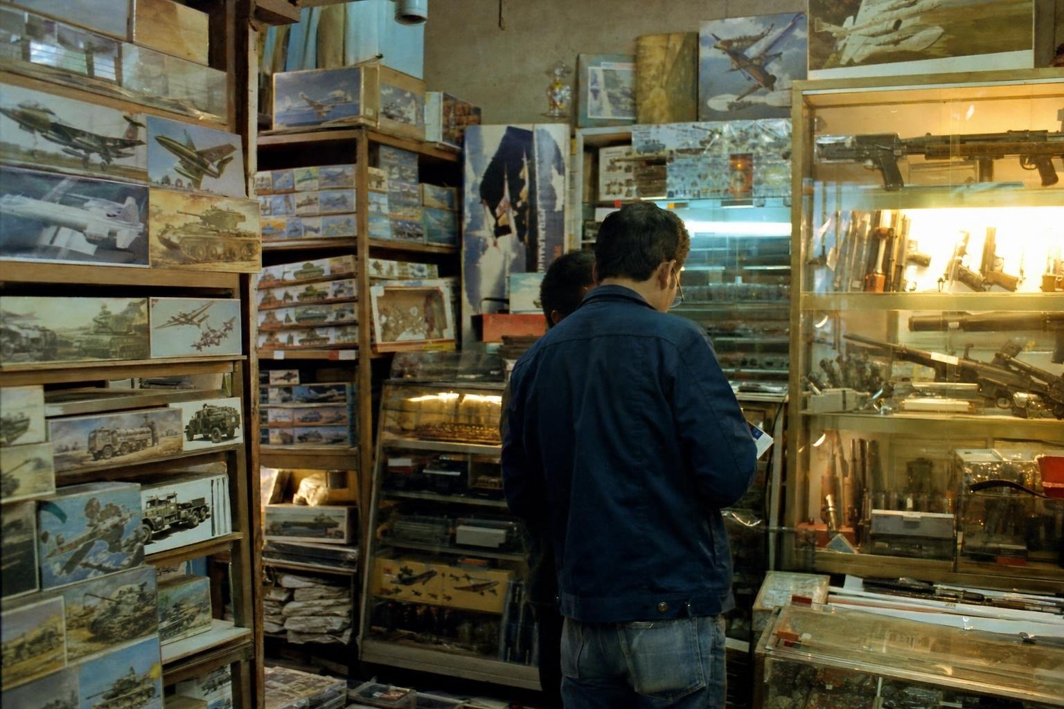 A small 1970s Japanese hobby shop with model kits and toy replicas on the shelves